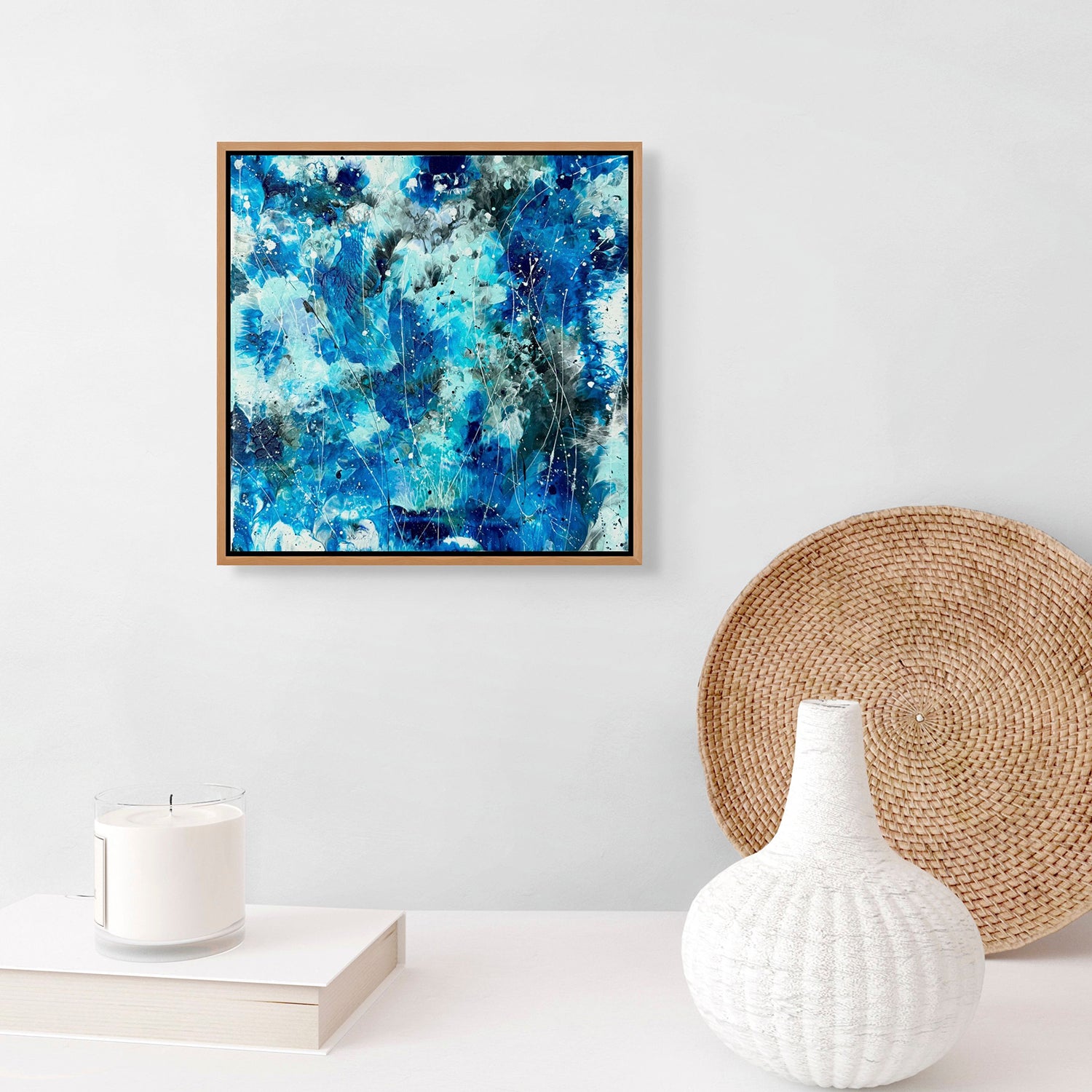 Image of Original Abstract Painting ' AZURE WATERS II" in Custom Tasmanian Oak Frame on white wall above white console. Artwork by Bridget Bradley contemporary artist Australia.