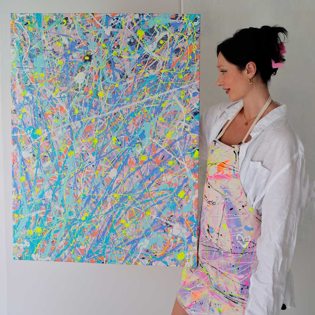Bridget Bradley, Abstract Expressionist Artist holds 'Iridescence'' original painting on canvas. Get Bridget's commission waitlist..