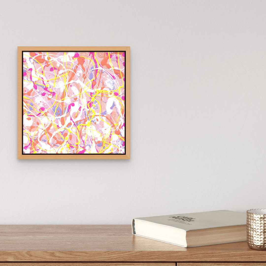 'Cupcake III' original expressionism painting by Bridget Bradley, seen here with an oak frame above a wooden table with book. Learn more about this contemporary artwork by Bridget