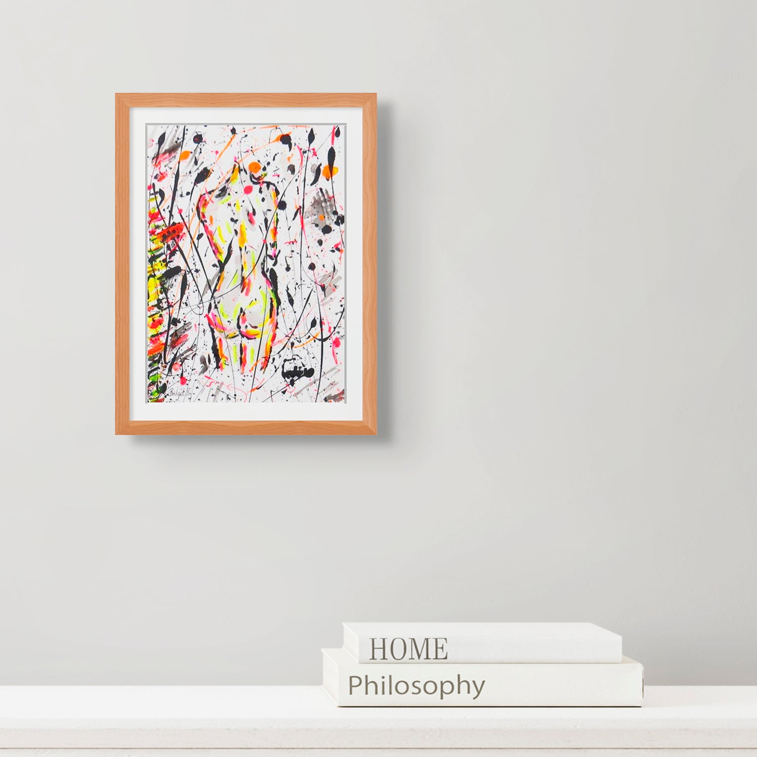 'Nude II' Original Abstract Mixed Media Painting on Art Paper by Bridget Bradley, seen framed in oak and hanging above books. Learn more