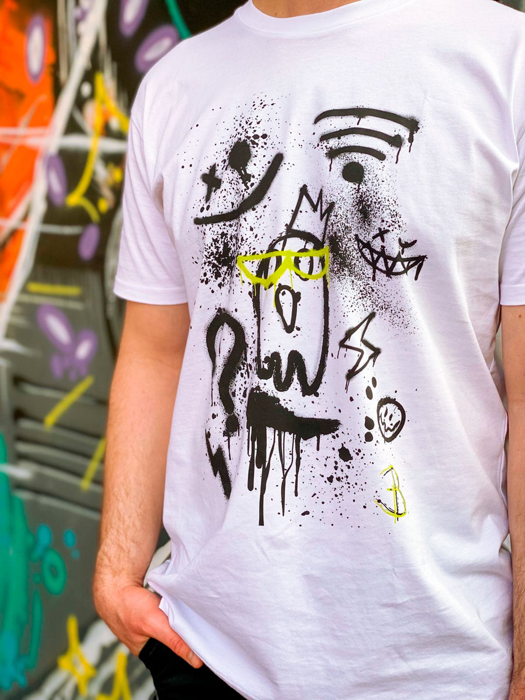 Front Design of the 'Off Grid' white mens or unisex t-shirt worn by model against a colourful background, designed by Bridget Bradley.