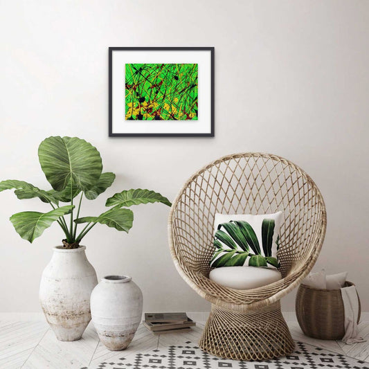Jungle, original abstract painting by Bridget Bradley, hanging in black frame with white mat in tropical decor setting.