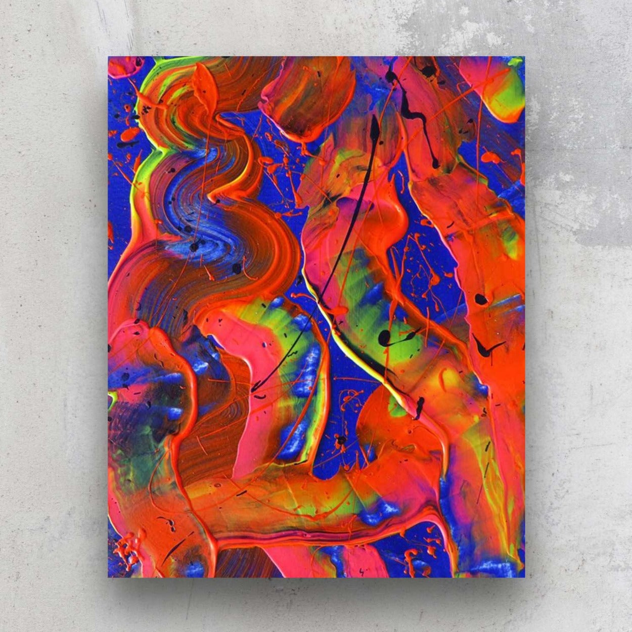 Little Luxuries I, original abstract painting on paper in bold reds, blues and neonsseen against a stone wall. Bridget Bradley abstract artist