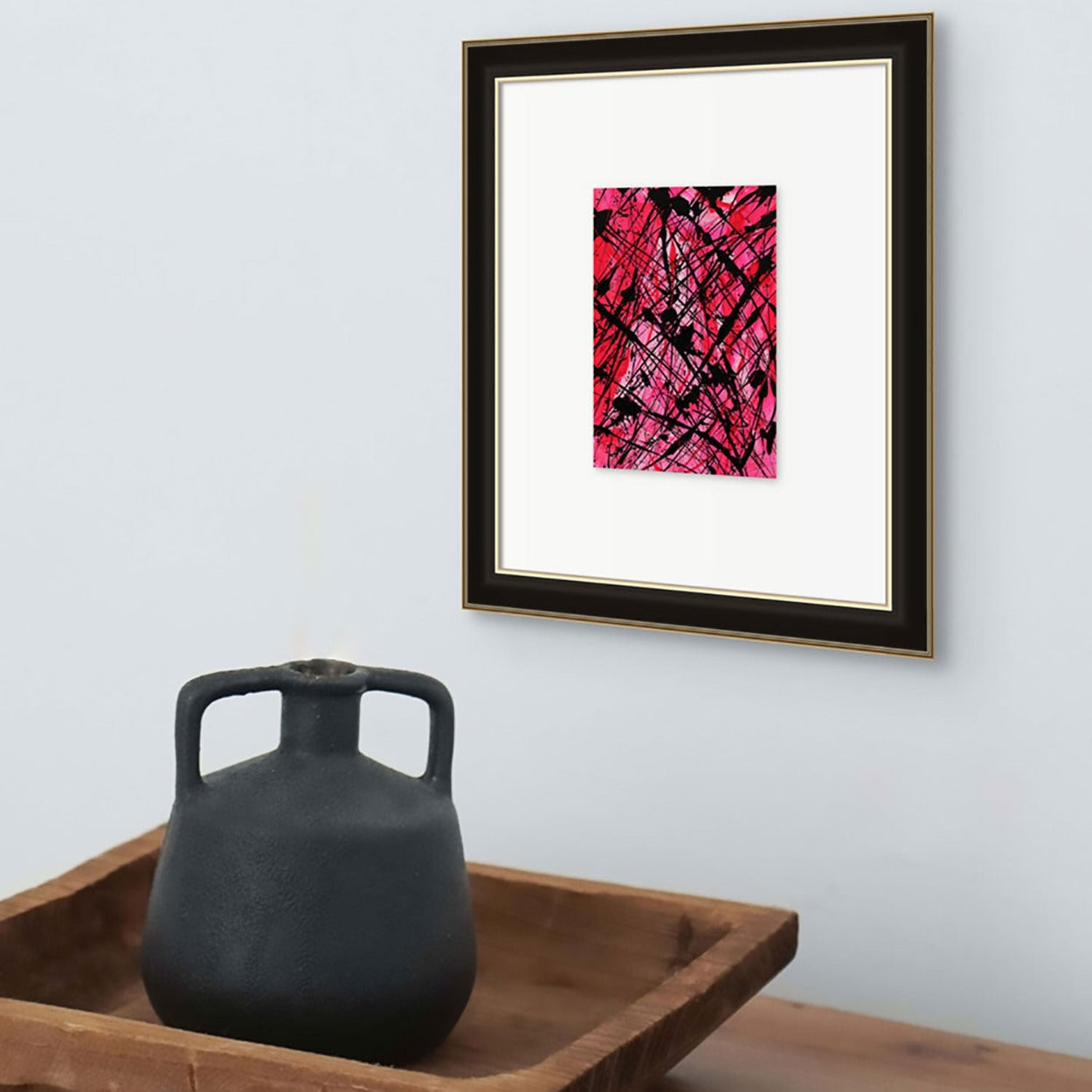 Neon II, original abstract art seen framed in situ with black vase on wooden tray.Painted by Bridget Bradley