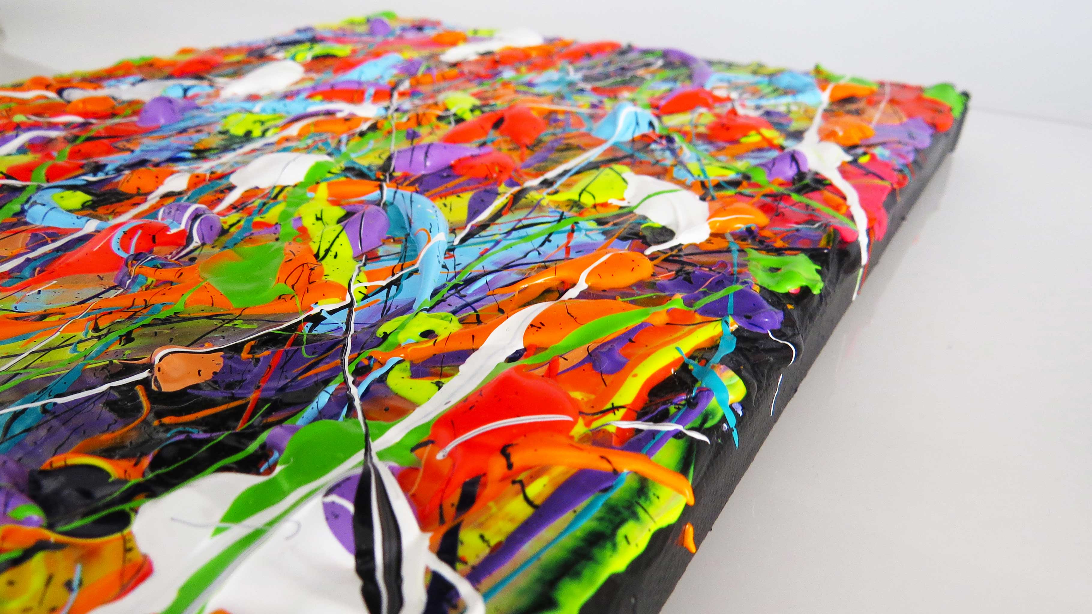 Closeup of heavily textured, tactile painting in bright colours. Artwork by Bridget Bradley