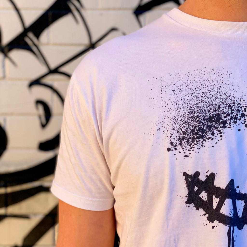 Image showing part of mens premium cotton white t-shirt with smile print on the front, designed by Bridget Bradley