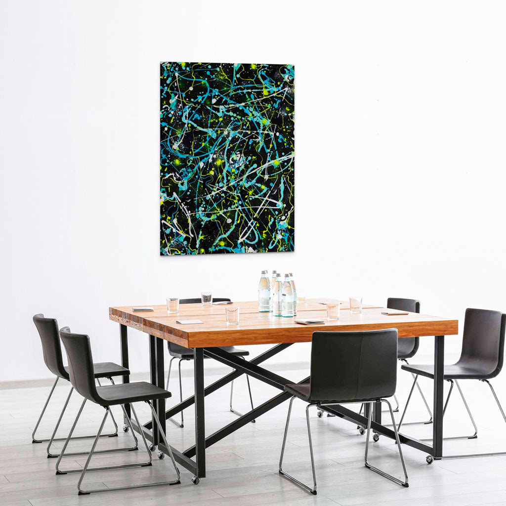 Alien Abstract Painting with vibrant neon yellow, blues ad white marks over black background on canvas seen hanging in board room.. Large canvas artwork painted by Bridget Bradley