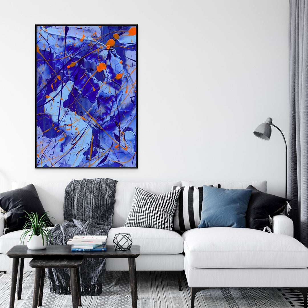 'Blue I' Lareg canvas print in Black Float Frame hanging above sofa with cushions. After the original artwork painted by Bridget Bradley