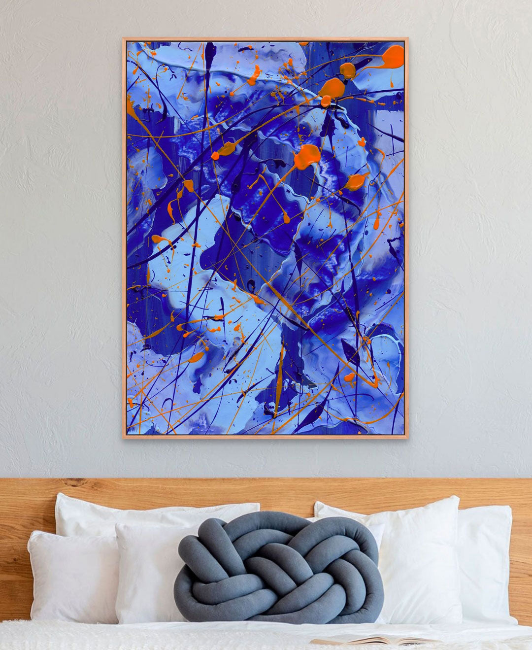 'Blue I' Canvas Art Print in Oak Float Frame Above Bed with Blue Cushion. After the hand painted abstract on paper by Bridget Bradley