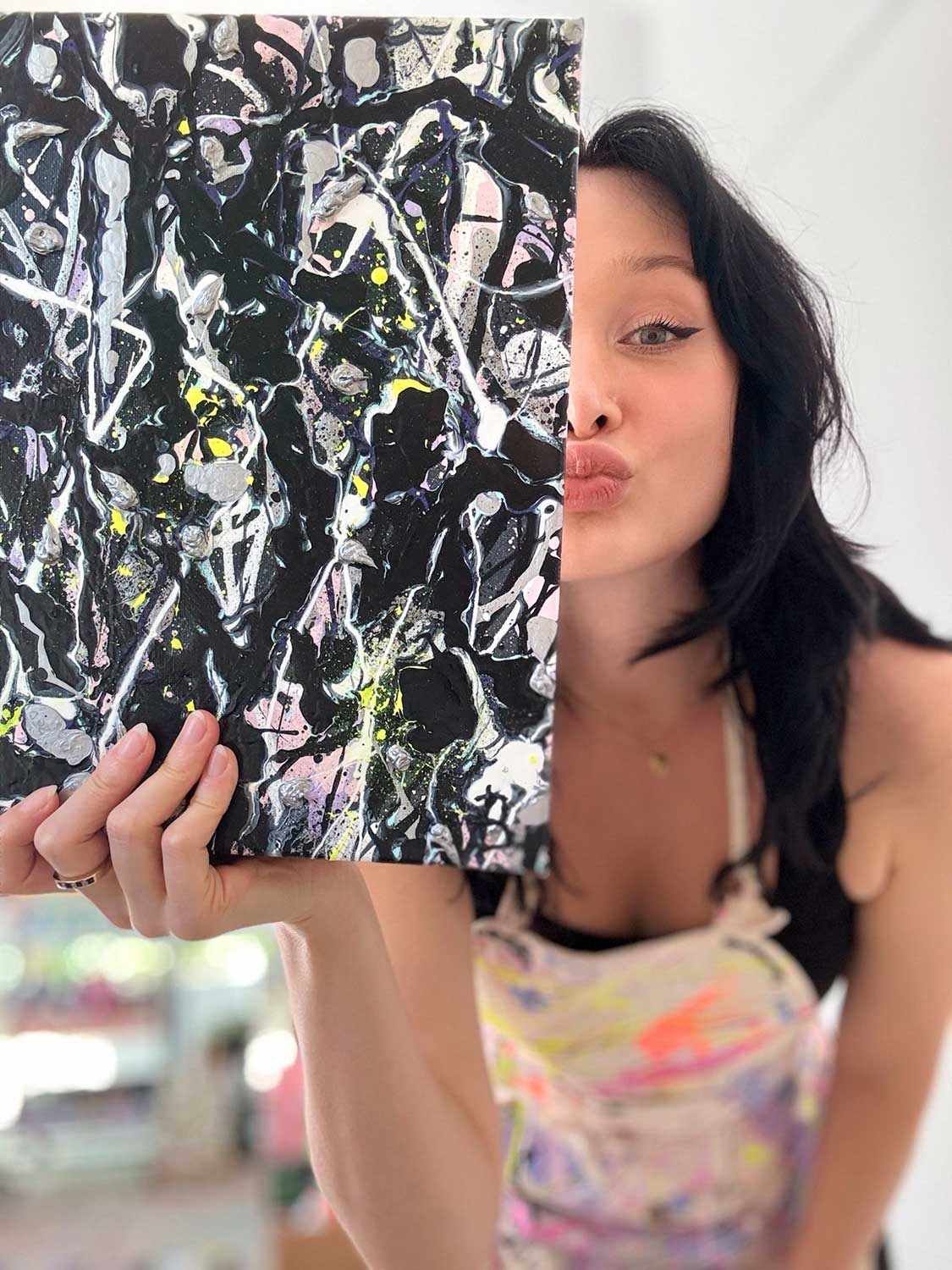 Bridget Bradley Holds Original Abstract From The Grey Series of Paintings