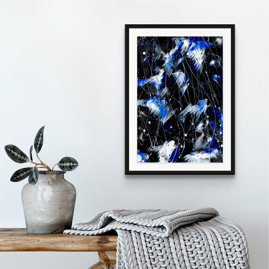 'Butterfly 7, Butterfly Series' Original Abstract painting on art paper seen framed in black and hanging with grey decor. Hand-painted by Bridget Bradley, Beautiful bright blue hues, black and white with movement , layers, depth and patterns. Discover more now