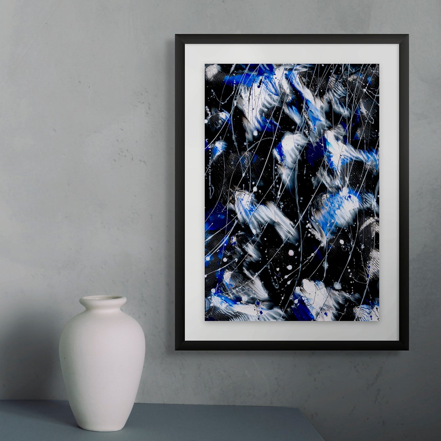 'Butterfly 8, Butterfly Series' Original abstract painting by Bridget Bradley seen framed in black and hanging near pottery vase. Learn more about this contemporary fine art now.