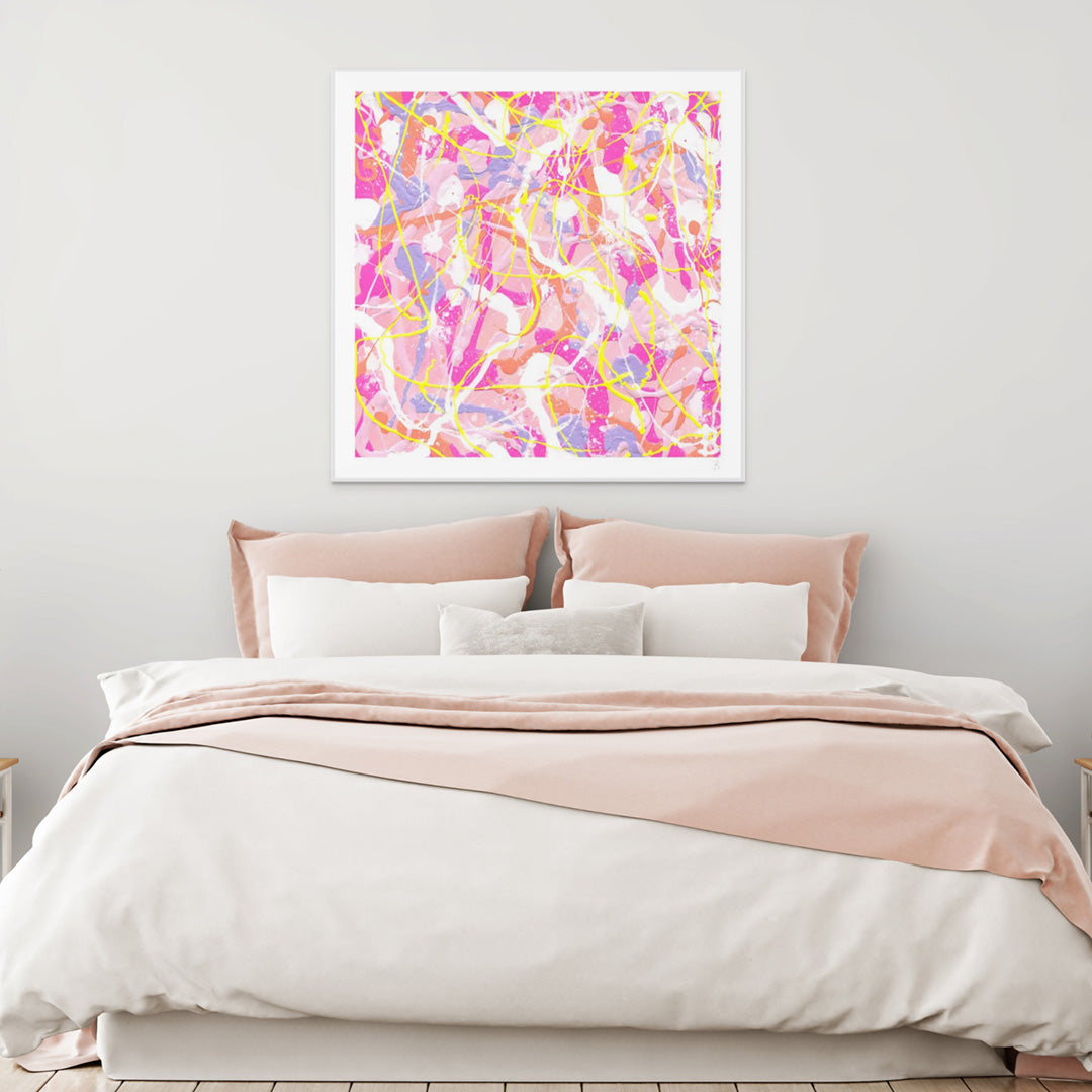 'Cupcake I' Fine Art Print On Paper seen with white shadow box frame hanging above a bed with pink and white linen covers. Large prints available framed or unframed.