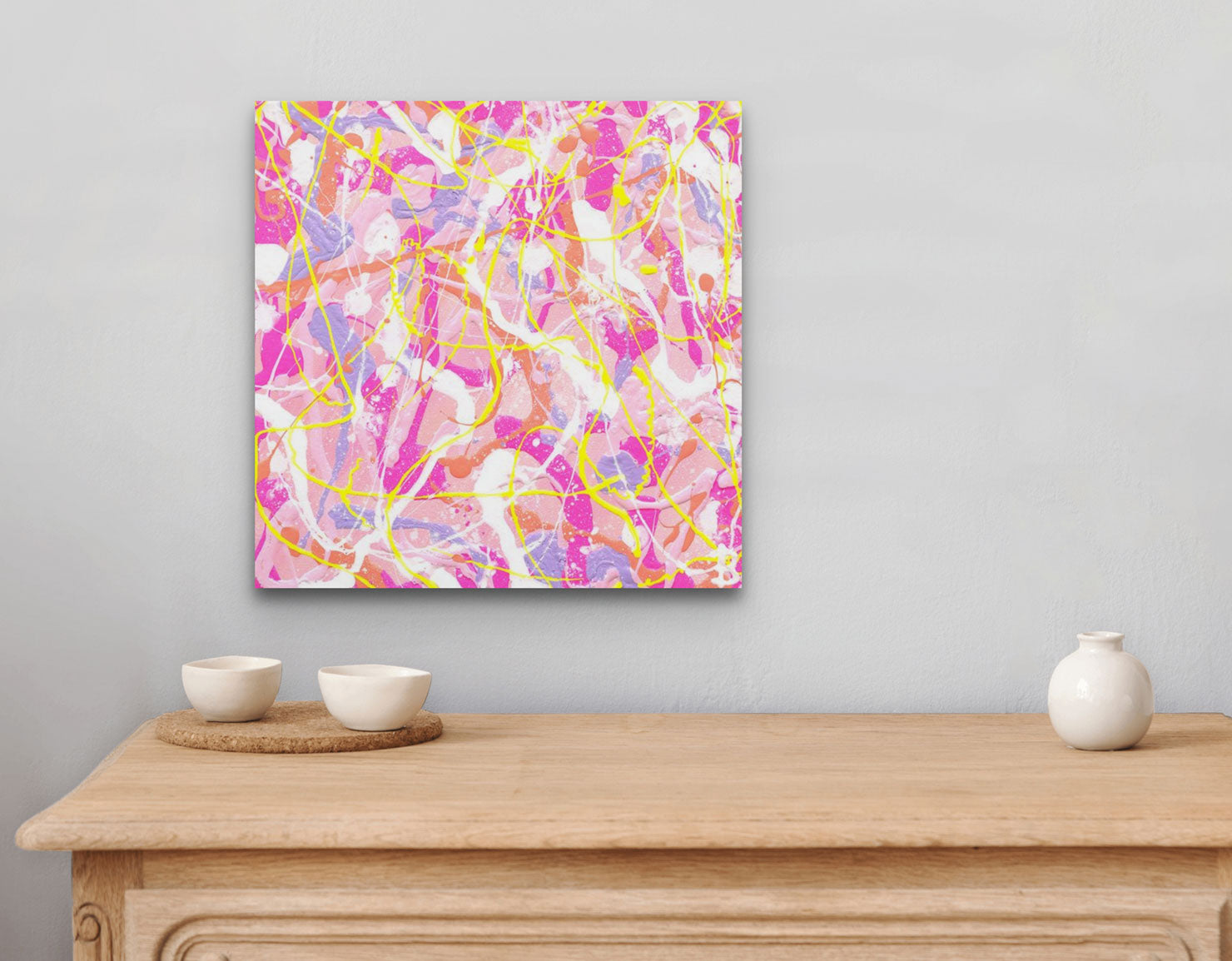 'Cupcake I' original, textured, abstract painting on canvas in beautiful pastel hues. Seen hanging above drawers with white ceramic bowls. Painted by Bridget Bradley, contemporary abstract Artist , Sunshine Coast Australia.