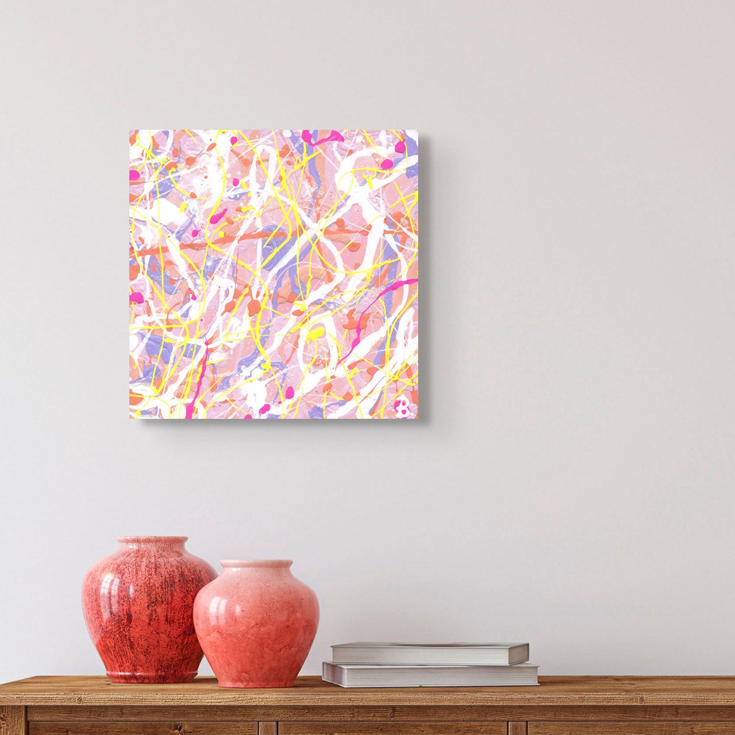 'Cupcake II' original abstract expressionism painting on canvas by Bridget Bradley, seen hanging in situ above orange vases on wooden console with books. This beautiful textured abstract. is available now!