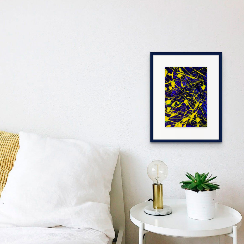 'Electric' original abstract on paper seen in bedroom setting framed. Unique abstract paintings by Bridget Bradley