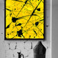 Geometric II fine art canvas print seen in black float frame on brick wall above black vases. After original abstract artwork by Bridget Bradley