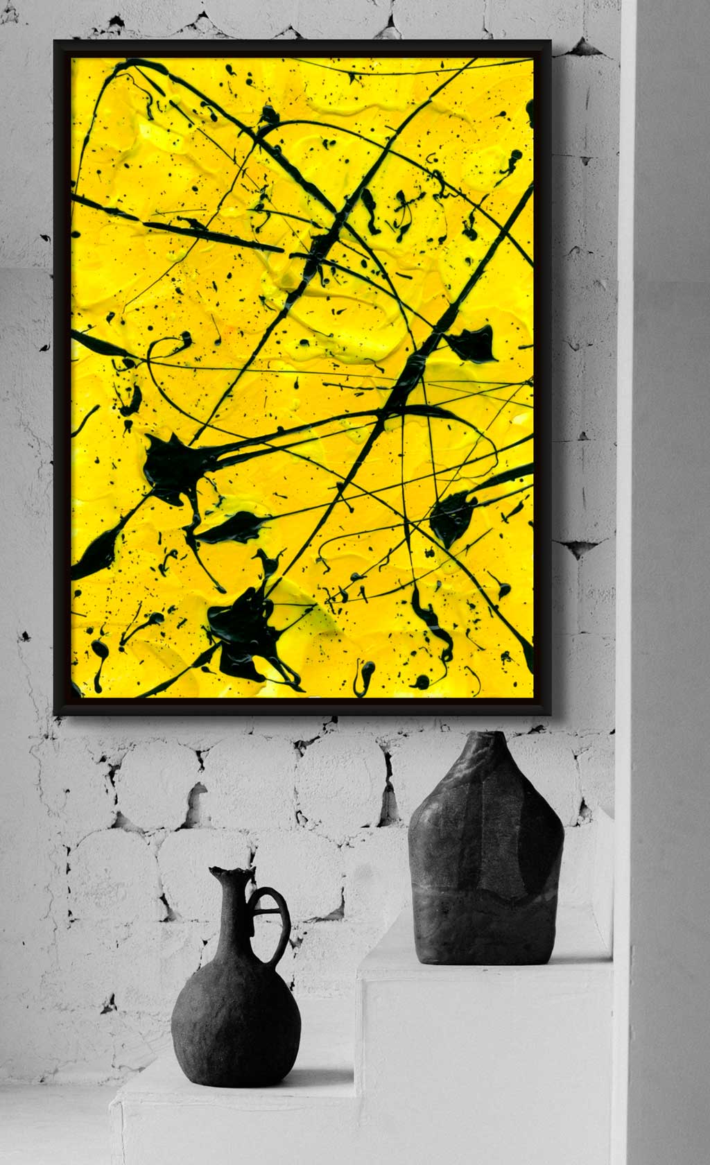 Geometric II fine art canvas print seen in black float frame on brick wall above black vases. After original abstract artwork by Bridget Bradley