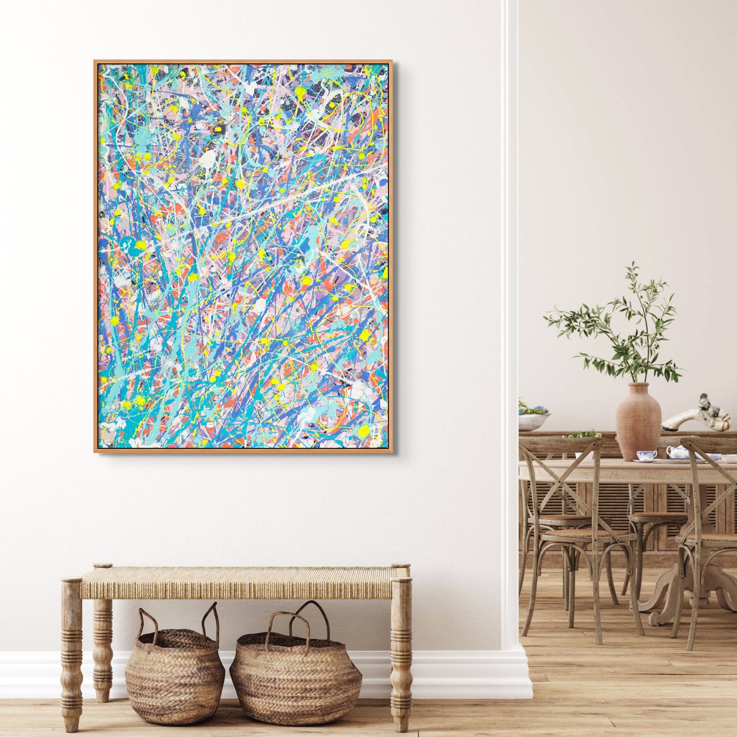 'Iridescence' original abstract expressionism painting on canvas by Bridget Bradley, seen in oak float frame above wicker table and baskets