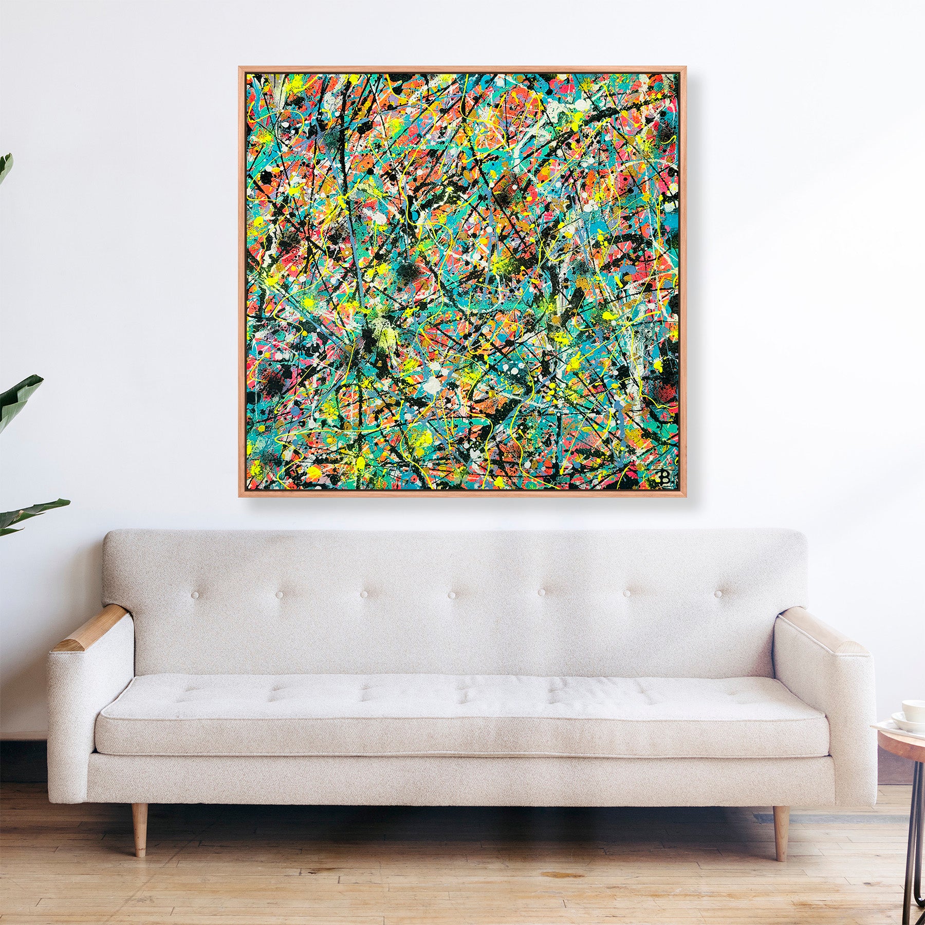 Labyrinth Fine Art Print with Oak Float Frame hanging above beige sofa  in Situ