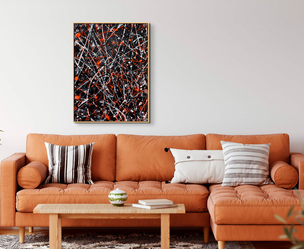 'Lava' original abstract expressionism painting on canvas seen framed in oak and hanging above a tan sofa. Painted by Bridget Bradley, Abstract Artist, Australia