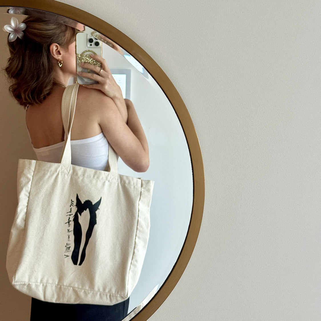 Bridget models the ' Horse's Soul Canvas Tote Bag showing main art print and quote. 