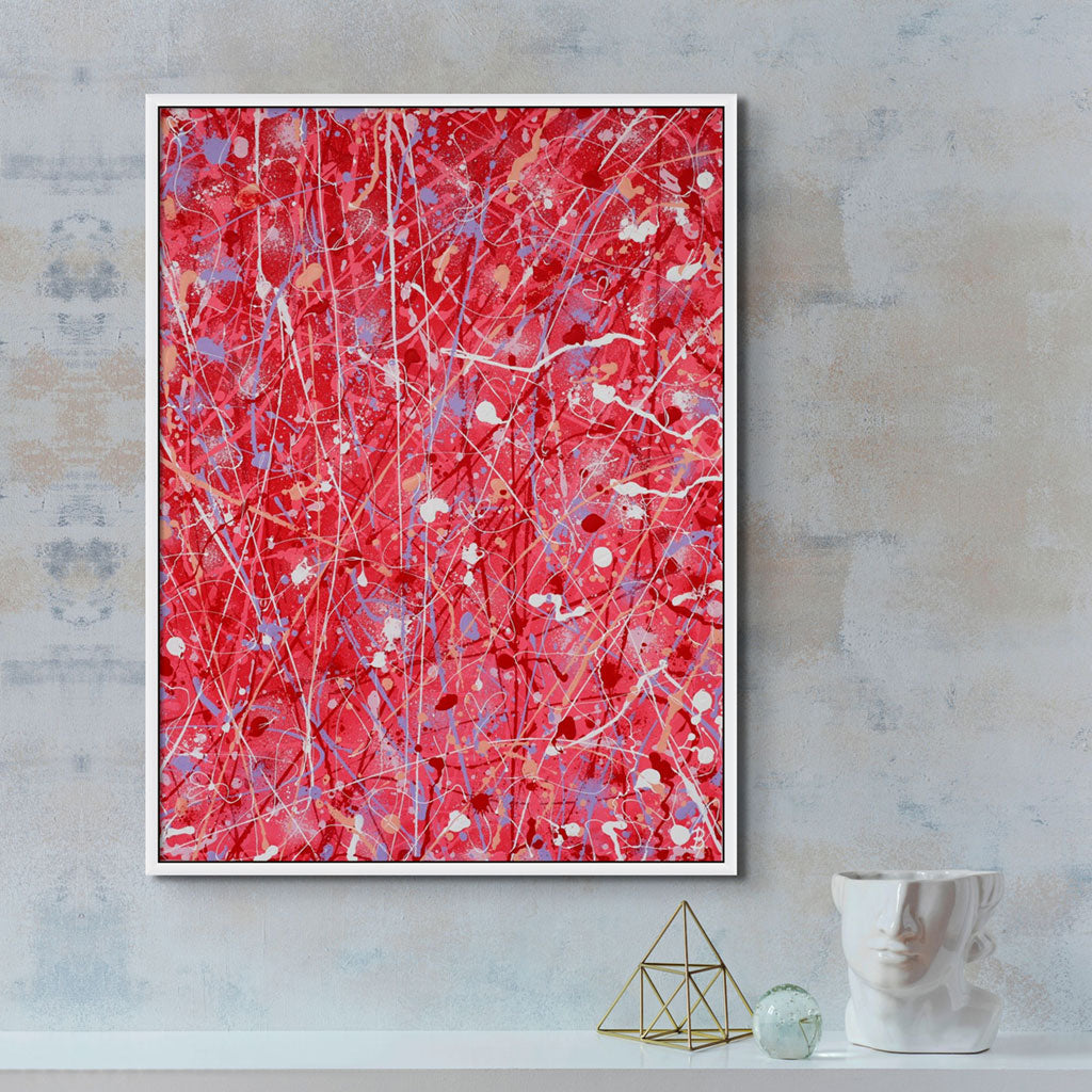 'Passion' original abstract expressionism painting on canvas seen in white float frame hanging above ornaments. Painted by Bridget Bradley, Abstract Artist, Australia