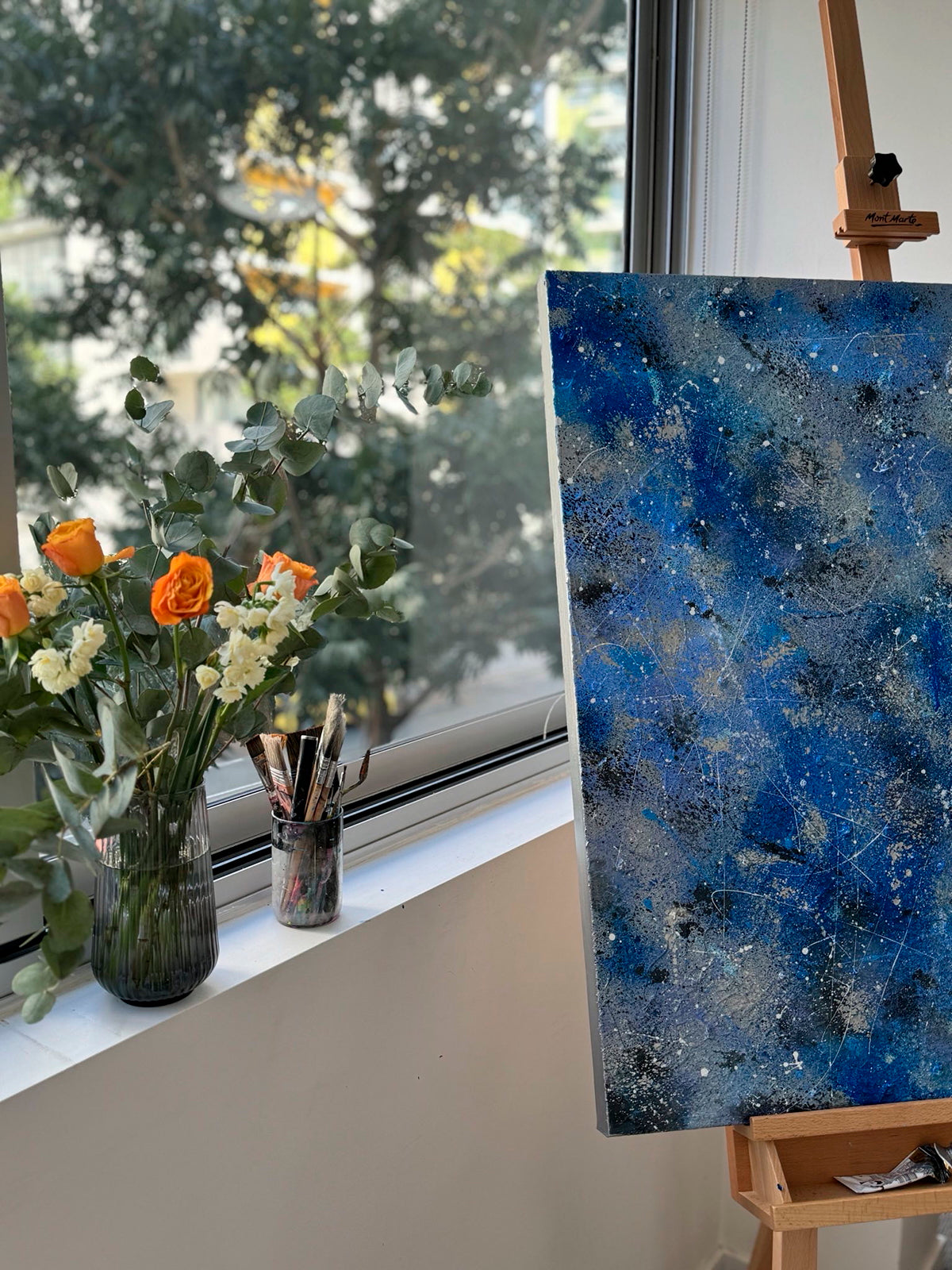 'Silver Rain II' Abstract Expressionism Painting On Easel in Studio by Window with vase of flowers. Artwork painted by Bridget Bradley, Contemporary Abstract expressionist Brisbane and Sunshine Coast Australia