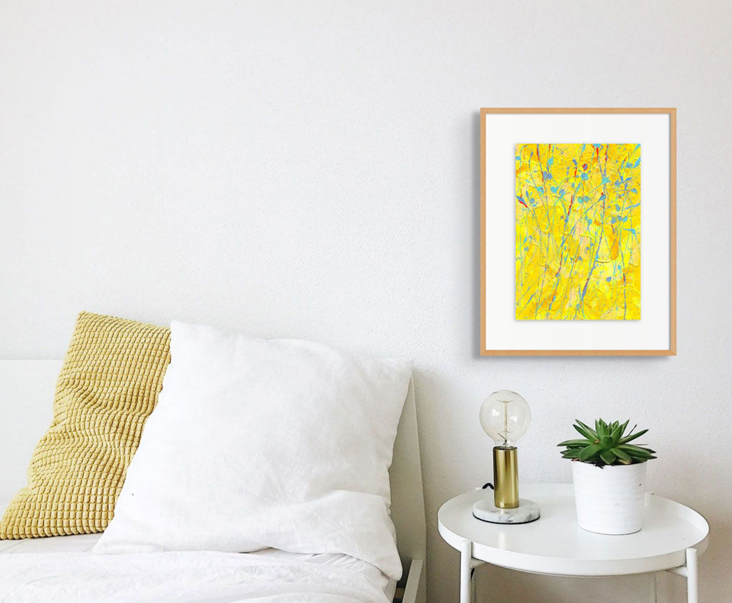 'Sunflower' original abstract art on paper by Contemporary Abstract Artist, Bridget Bradley. Seen framed in oak and hanging in situ above a white table
