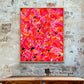 'Sunset Desert' original abstract expressionist painting on canvas by Bridget Bradley seen hanging in situ on brick wall above wooden table.