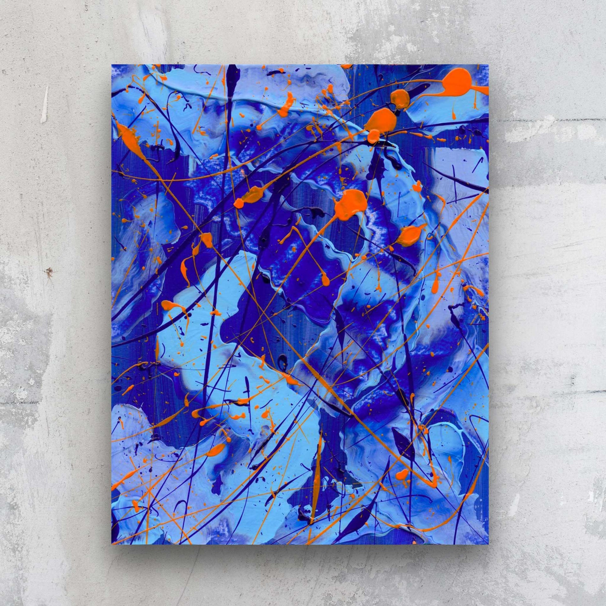 Blue I, original bold abstract in blues and neons by Bridget Bradley, seen hanging on stone wall