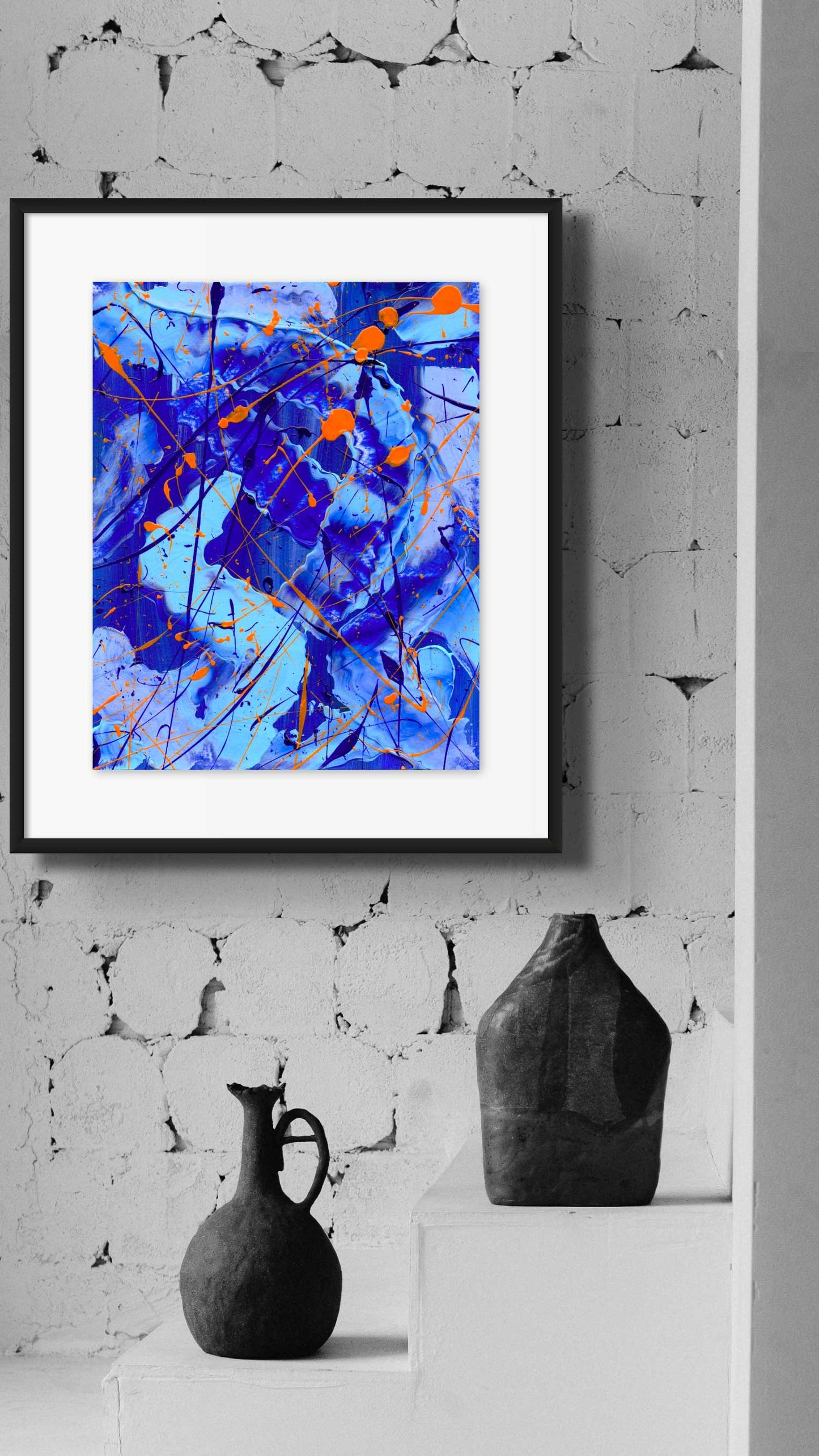 Blue I, original painting seen framed hanging on brick wall. Abstract wall art on paper by Bridget Bradley