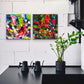 from left 'City Days' and'City Nights' , original, brightly coloured abstract paintings seen hanging in modern kitchen on white wall. Painted by abstract artist, Bridget Bradley