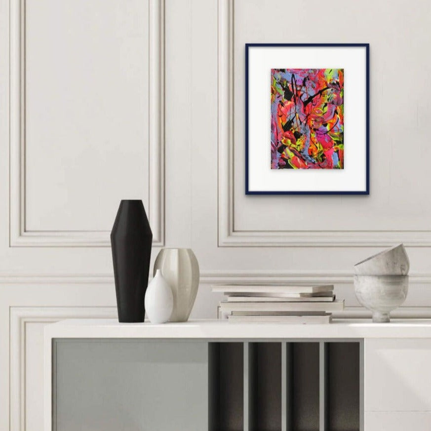 Little Luxuries VII, original abstract wall art seen framed, hanging on neutral wall above white and black decor. Painted by Bridget Bradley