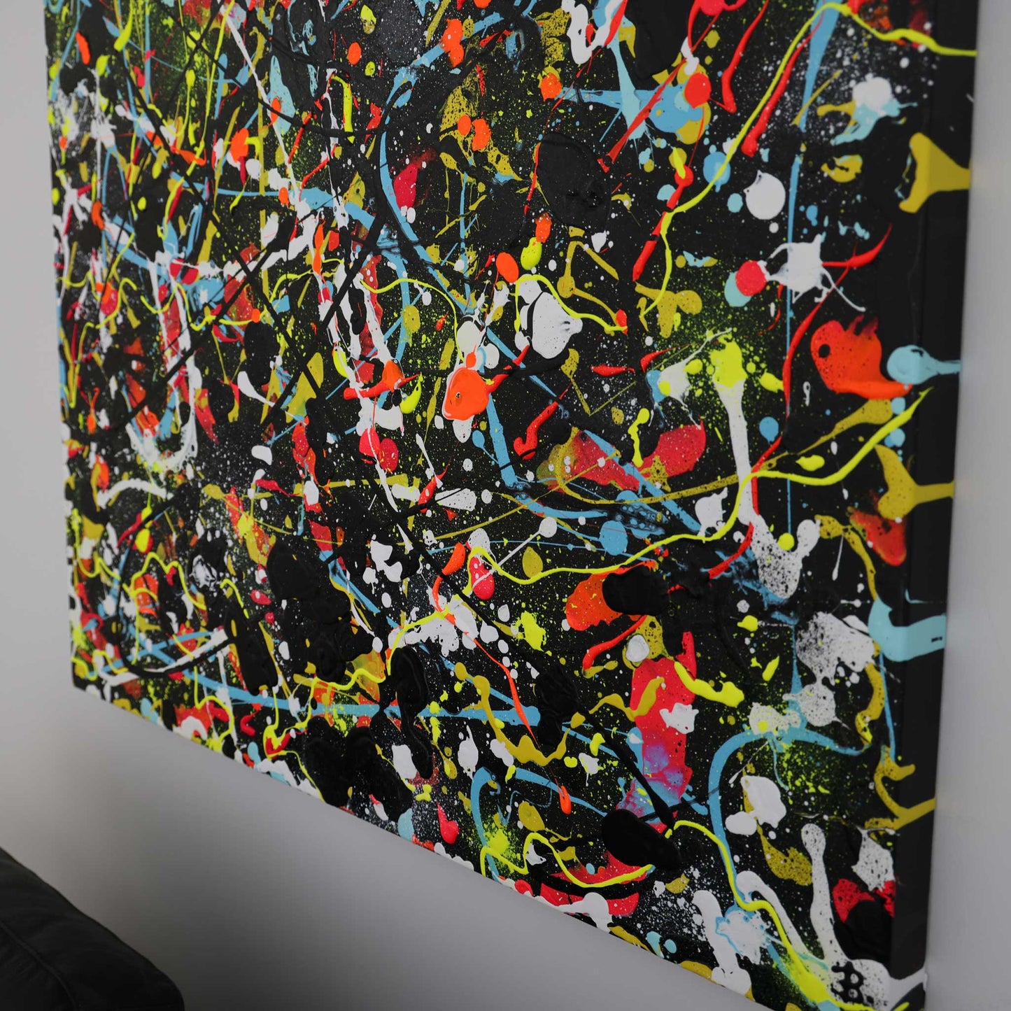 Original abstract painting in bright colours and black on canvas seen from side view close up. Painting by Bridget Bradley, Abstract Artist