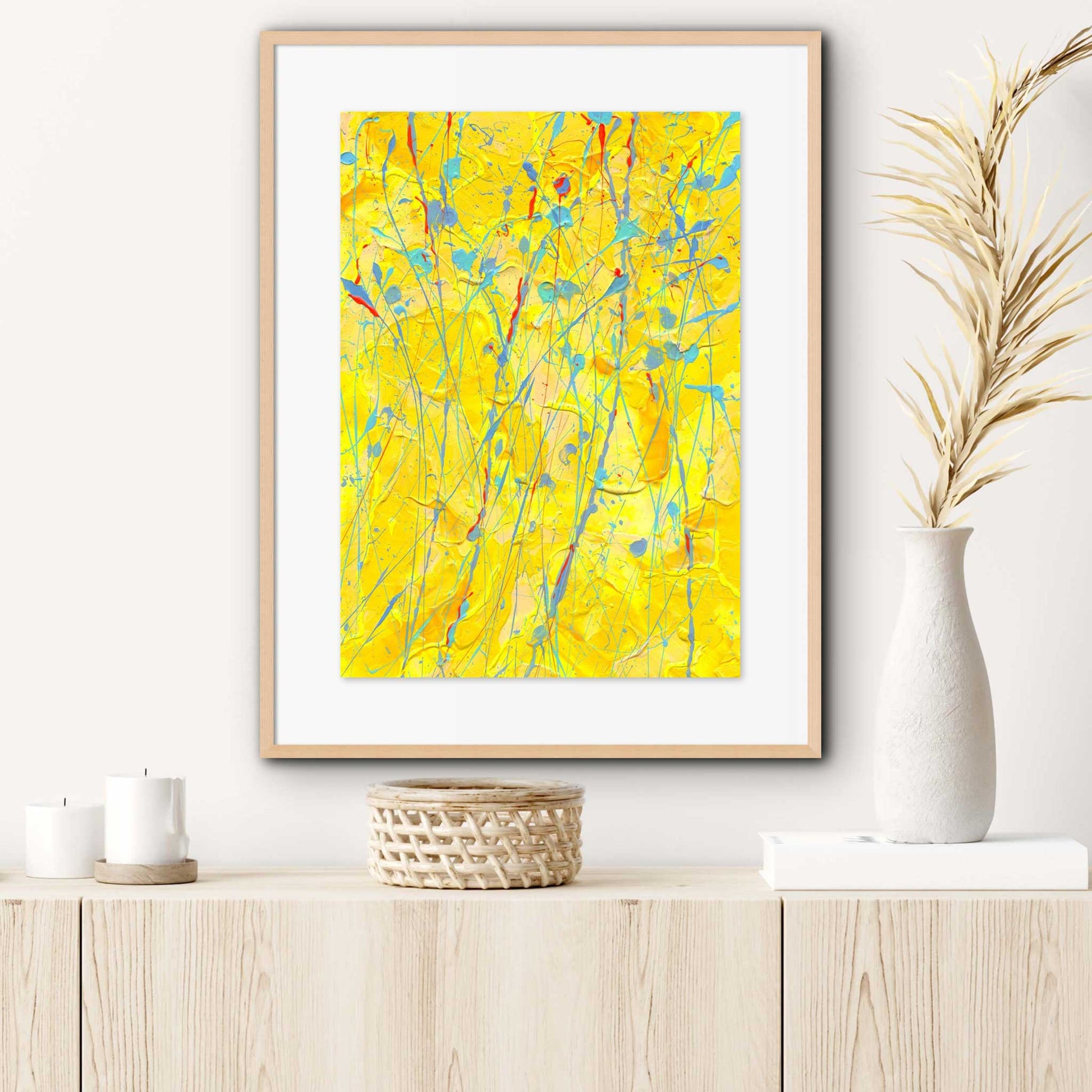 Sunflower is an original abstract painting on archival paper, by Brigdet Bradley, Seen here framed in oak hanging in situ with neutral decor. Find out more.
